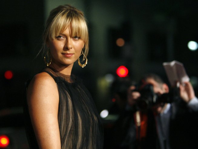 Красивата Маша омая българския тенисист. Снимка: Reuters