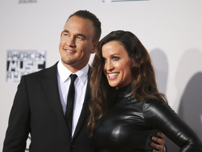 Аланис Морисет и съпругът ѝ Марио Тредуей. Снимка: Reuters